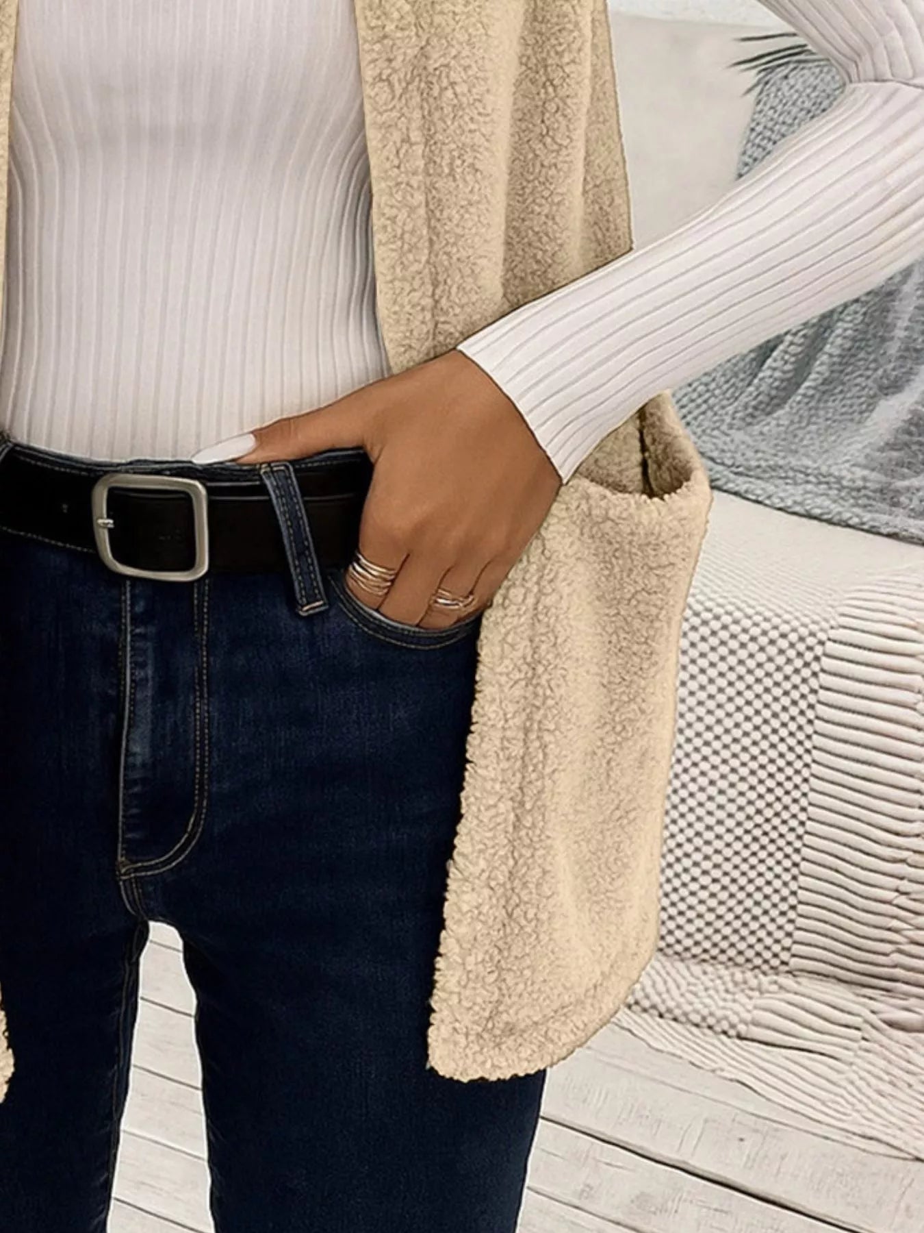 Warm sleeveless fleece vest ideal for layering, offering comfort and versatility in cold weather.