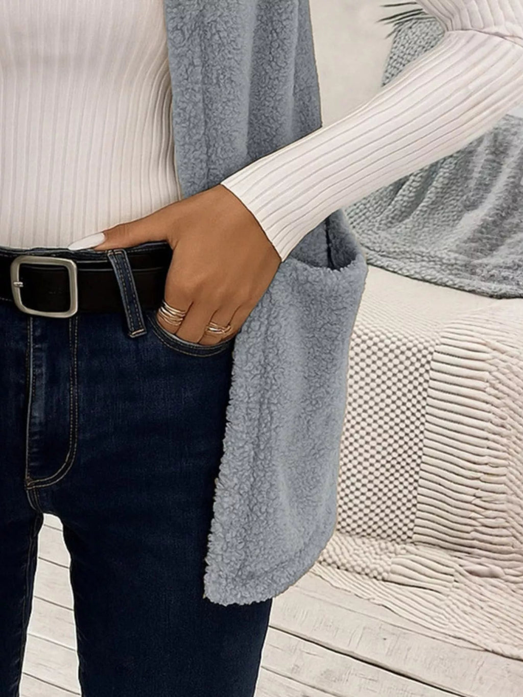 Warm sleeveless fleece vest ideal for layering, offering comfort and versatility in cold weather.