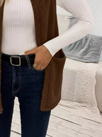 Warm sleeveless fleece vest ideal for layering, offering comfort and versatility in cold weather.