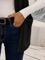 Warm sleeveless fleece vest ideal for layering, offering comfort and versatility in cold weather.