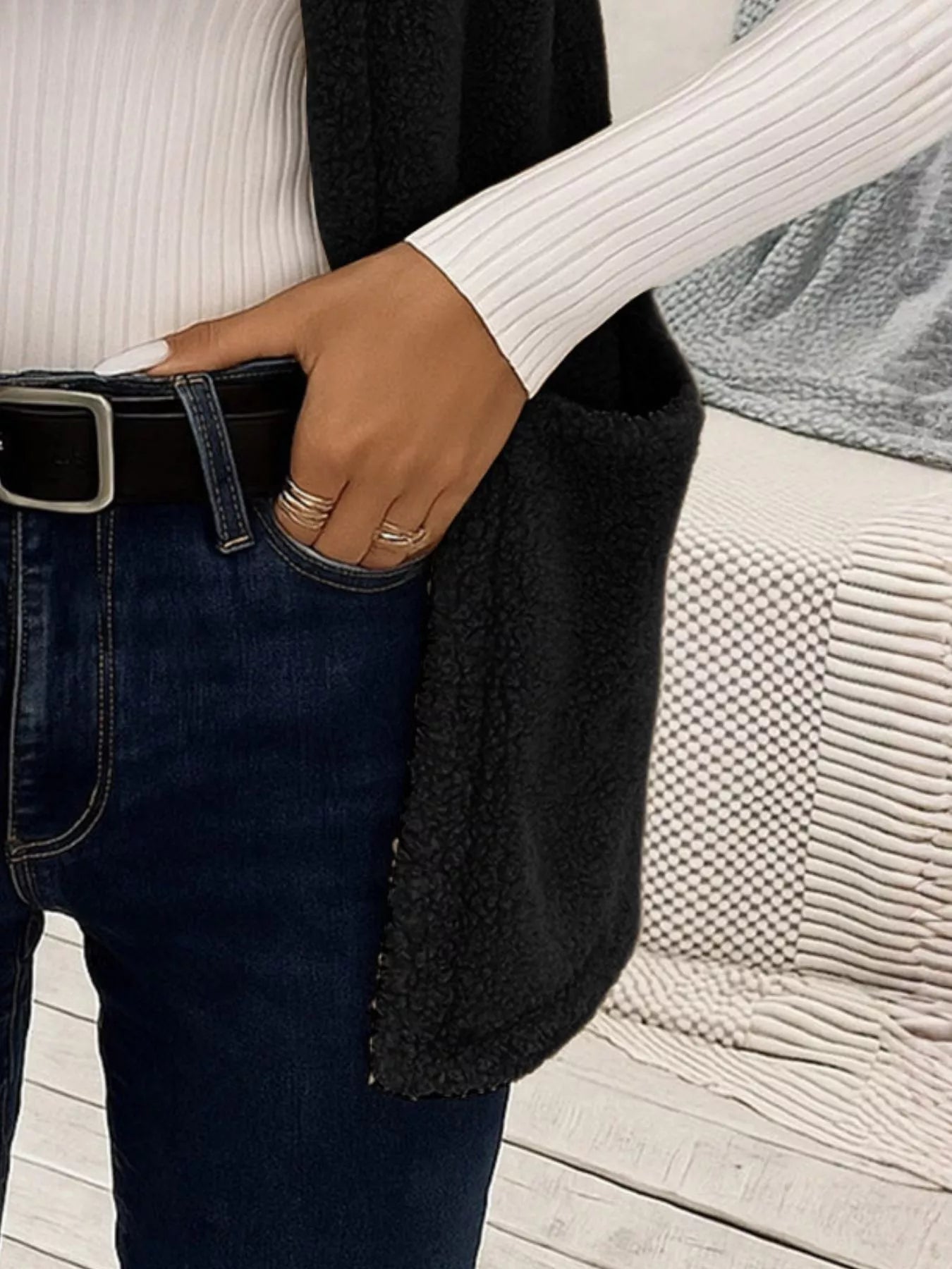 Warm sleeveless fleece vest ideal for layering, offering comfort and versatility in cold weather.