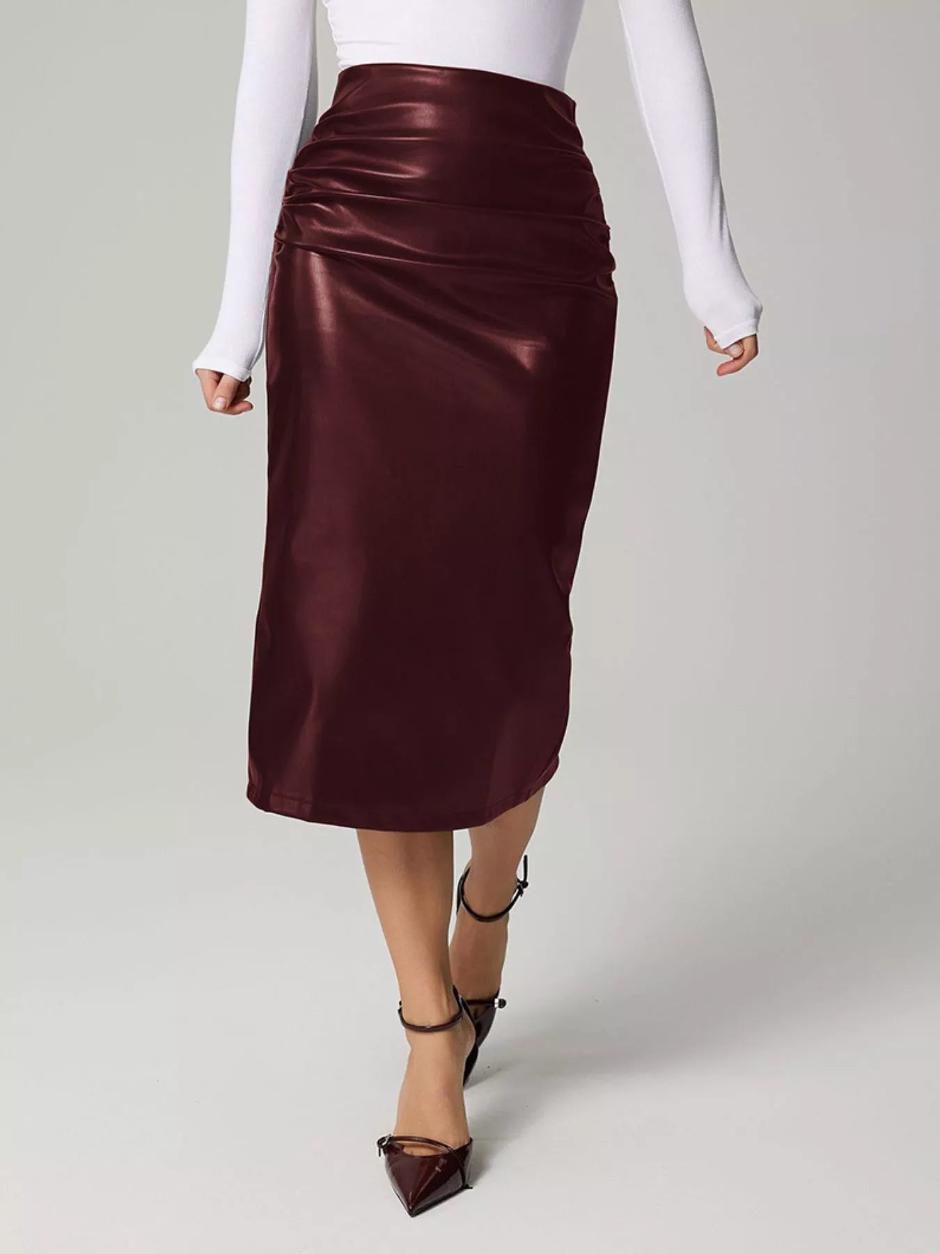 Stylish leather skirt for professional attire, crafted from premium leather to enhance formal wardrobe elegance.