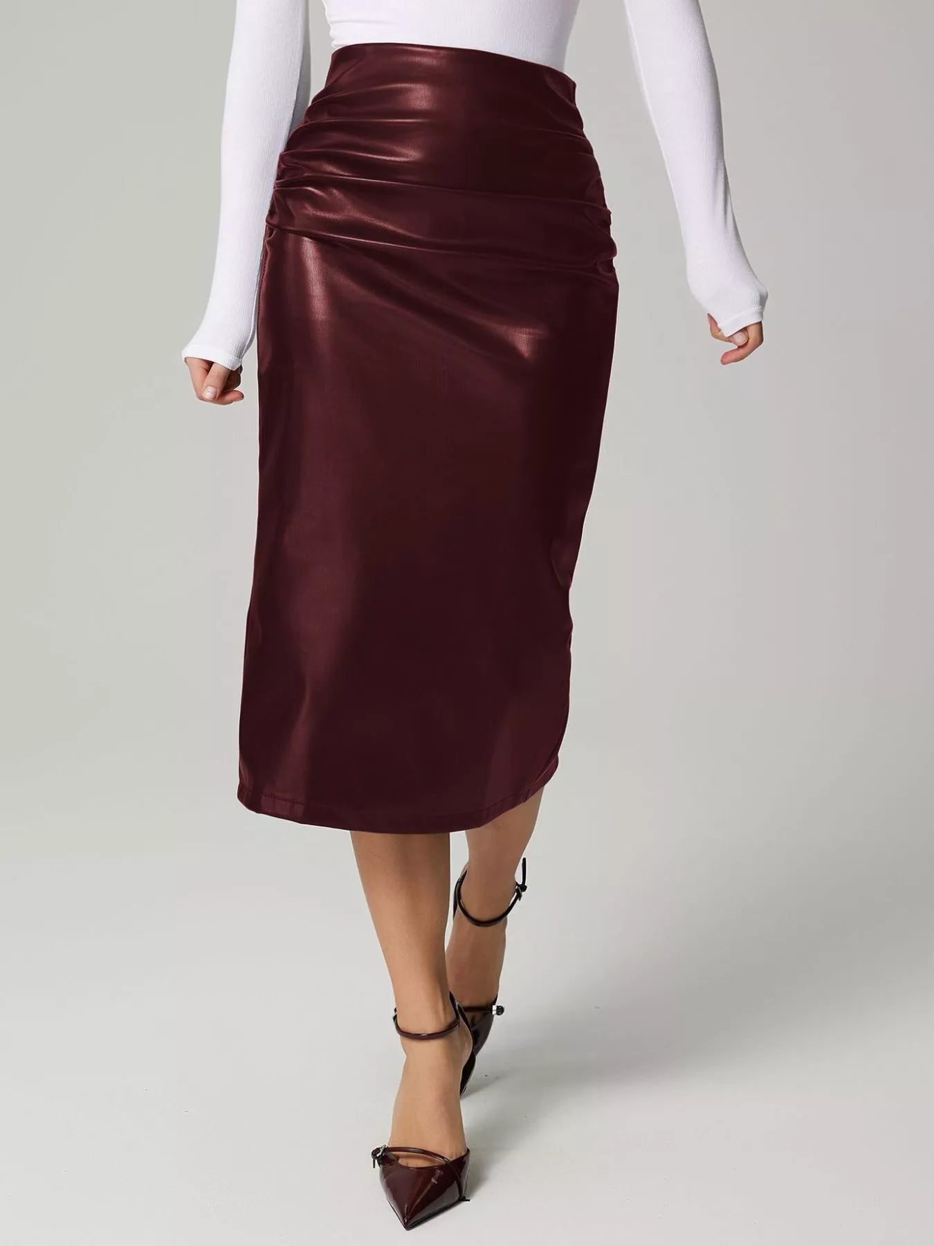 Stylish leather skirt for professional attire, crafted from premium leather to enhance formal wardrobe elegance.