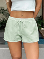 Stylish textured drawstring shorts ideal for casual wear and comfortable summer fashion.