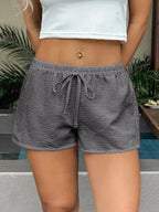Stylish textured drawstring shorts ideal for casual wear and comfortable summer fashion.