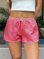 Stylish textured drawstring shorts ideal for casual wear and comfortable summer fashion.