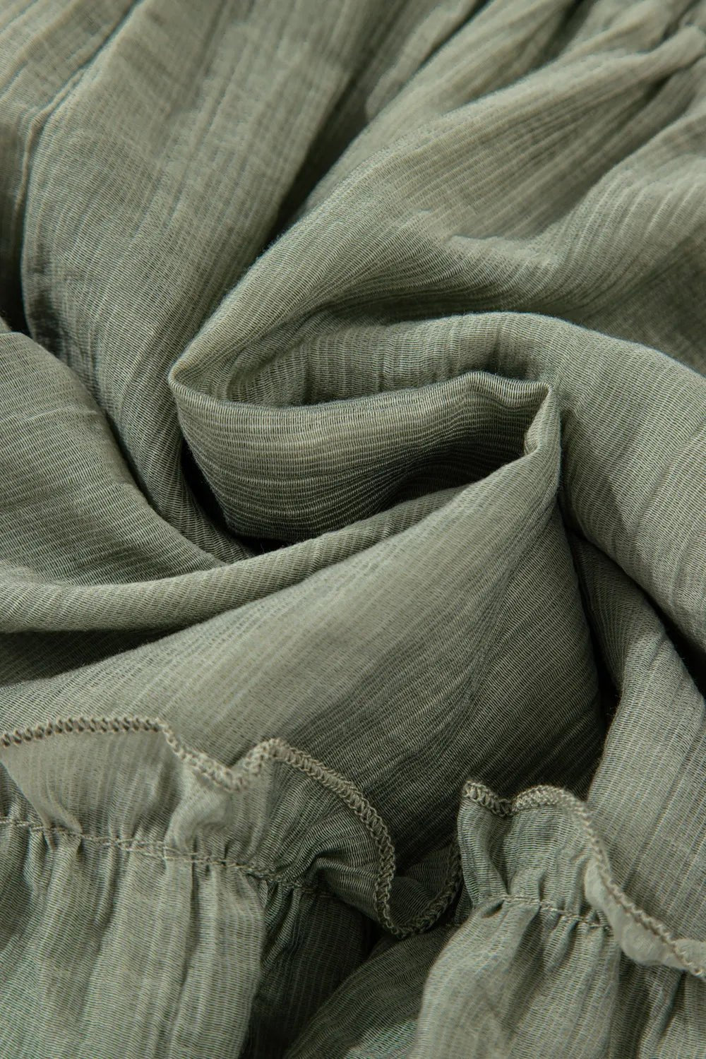 Tie waist shorts with elegant ruffle hem detail, perfect for a stylish and comfortable summer outfit.