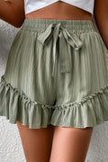 Tie waist shorts with elegant ruffle hem detail, perfect for a stylish and comfortable summer outfit.