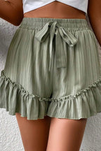 Tie waist shorts with elegant ruffle hem detail, perfect for a stylish and comfortable summer outfit.