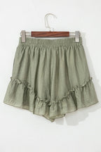 Tie waist shorts with elegant ruffle hem detail, perfect for a stylish and comfortable summer outfit.