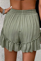 Tie waist shorts with elegant ruffle hem detail, perfect for a stylish and comfortable summer outfit.