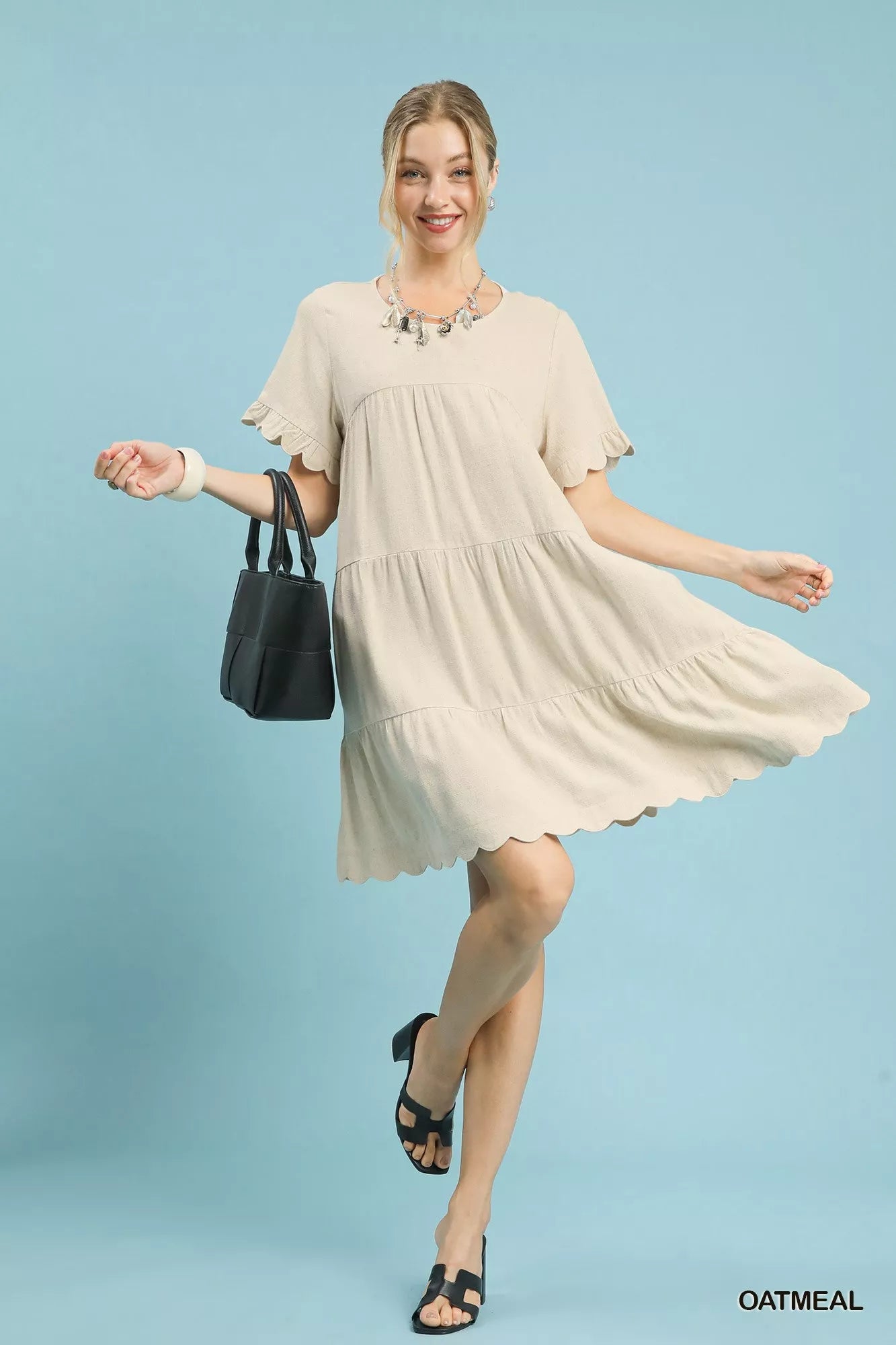Umgee Linen Tiered Babydoll Dress with Ruffle Sleeves.