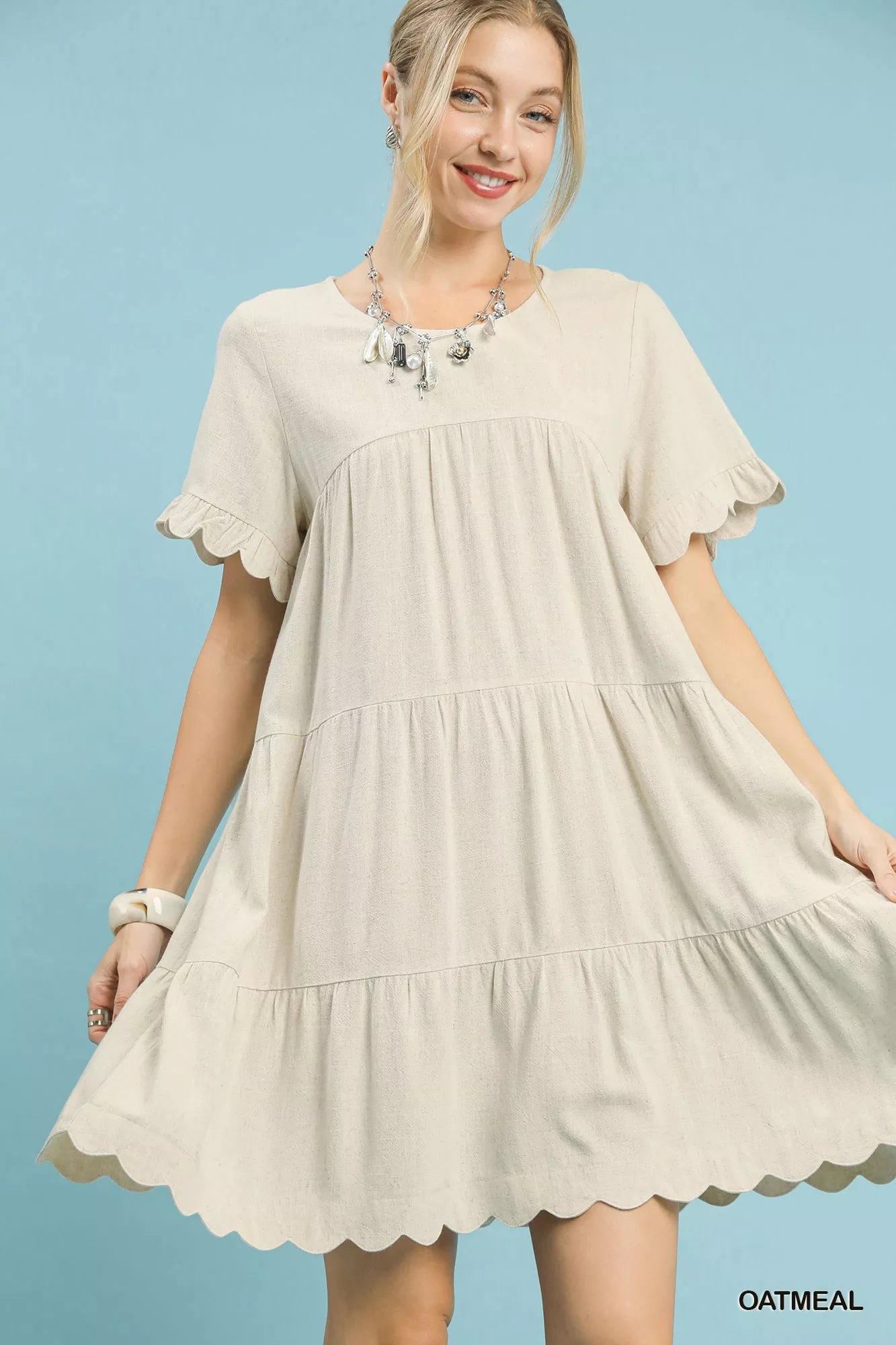 Umgee Linen Tiered Babydoll Dress with Ruffle Sleeves.