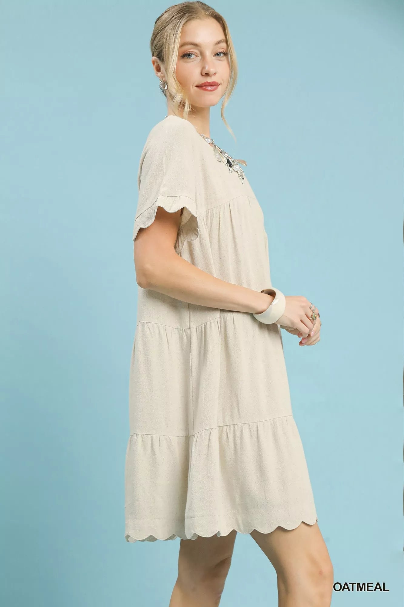 Umgee Linen Tiered Babydoll Dress with Ruffle Sleeves.