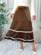 Elegant velvet midi skirt in rich texture, perfect for sophisticated occasions and stylish wardrobe essentials.