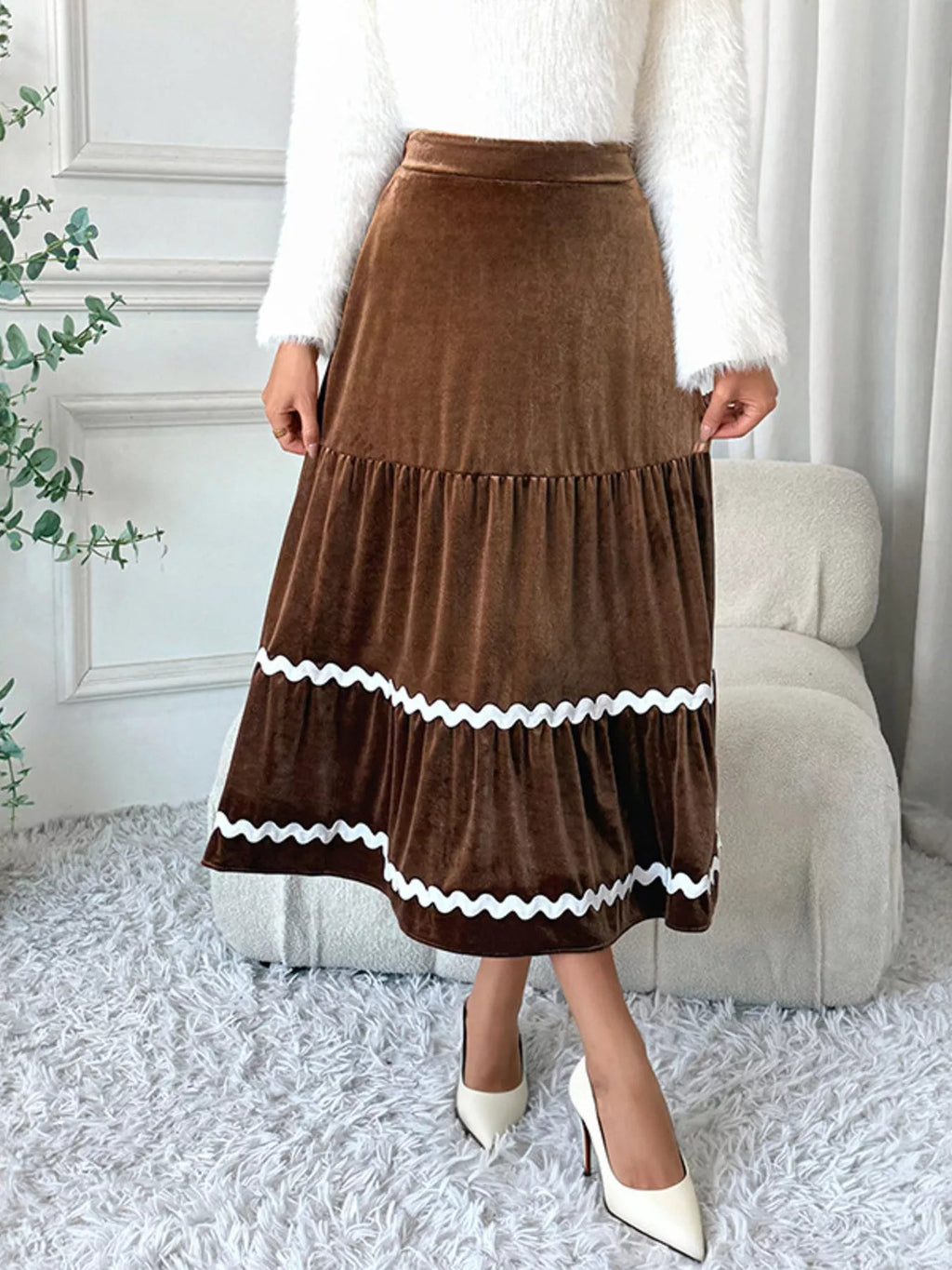 Elegant velvet midi skirt in rich texture, perfect for sophisticated occasions and stylish wardrobe essentials.