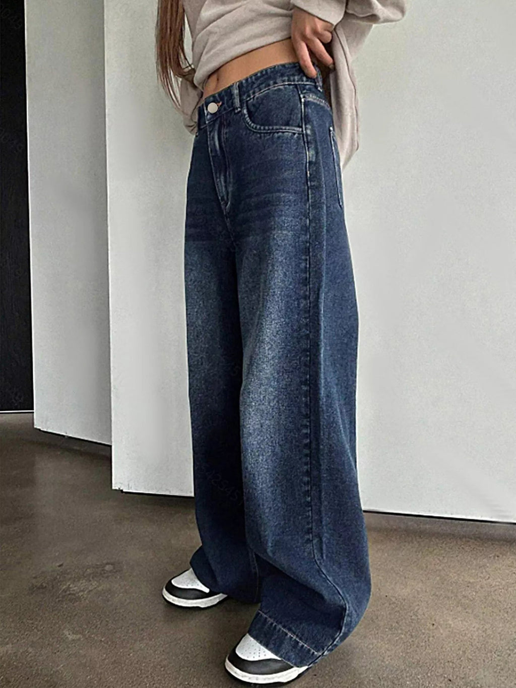 Classic vintage wide leg jeans offering timeless style and comfortable fit for versatile fashion looks.
