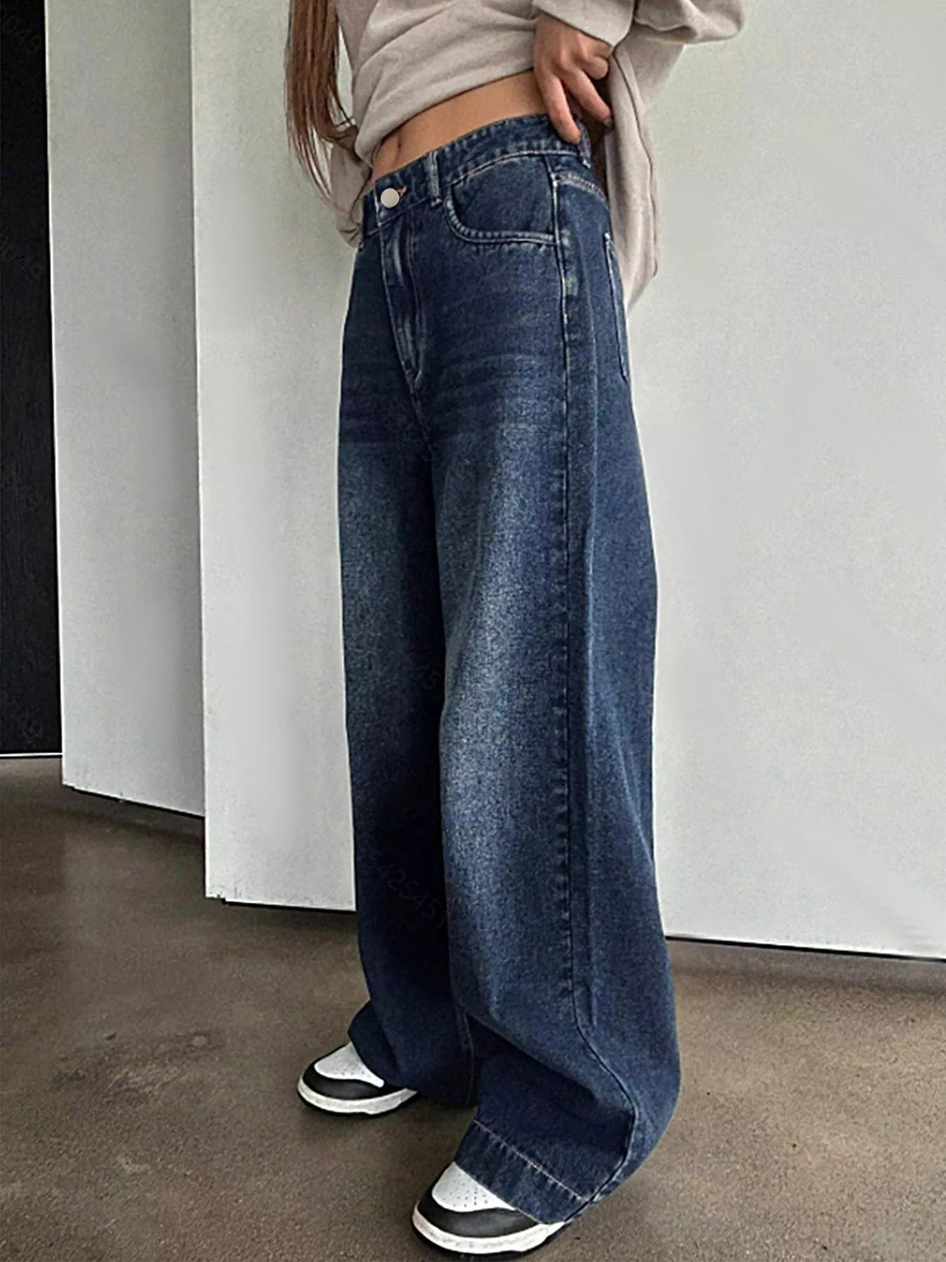 Classic vintage wide leg jeans offering timeless style and comfortable fit for versatile fashion looks.