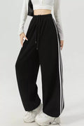 Elegant striped wide leg pants perfect for professional and casual wear, featuring a comfortable and stylish fit.