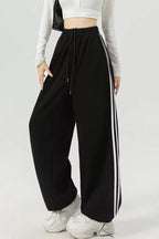 Elegant striped wide leg pants perfect for professional and casual wear, featuring a comfortable and stylish fit.