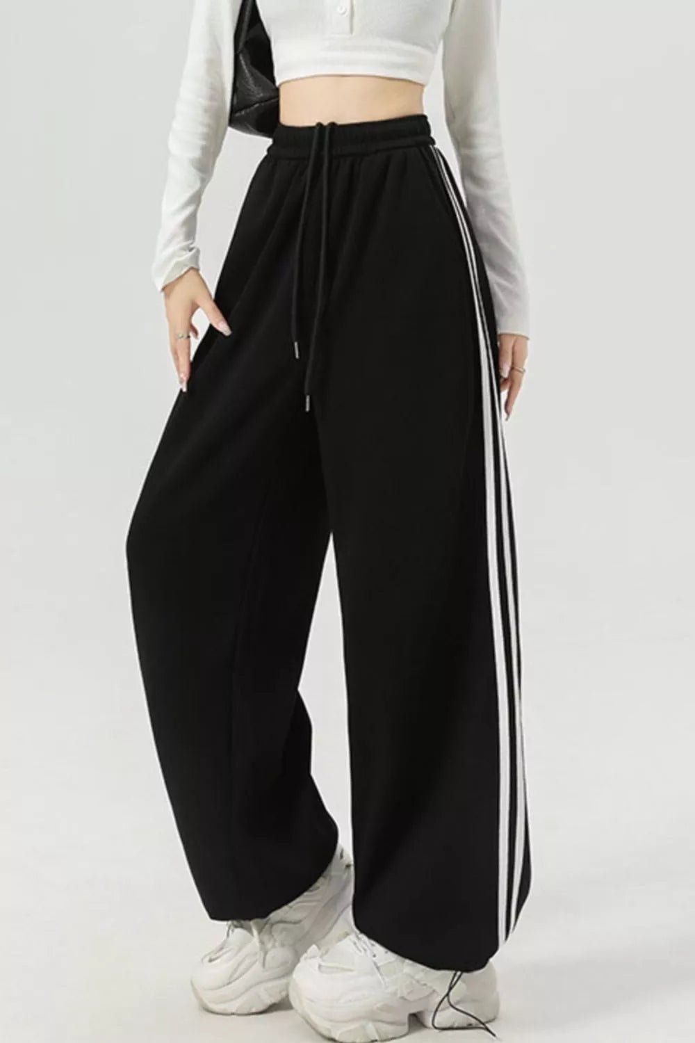 Elegant striped wide leg pants perfect for professional and casual wear, featuring a comfortable and stylish fit.