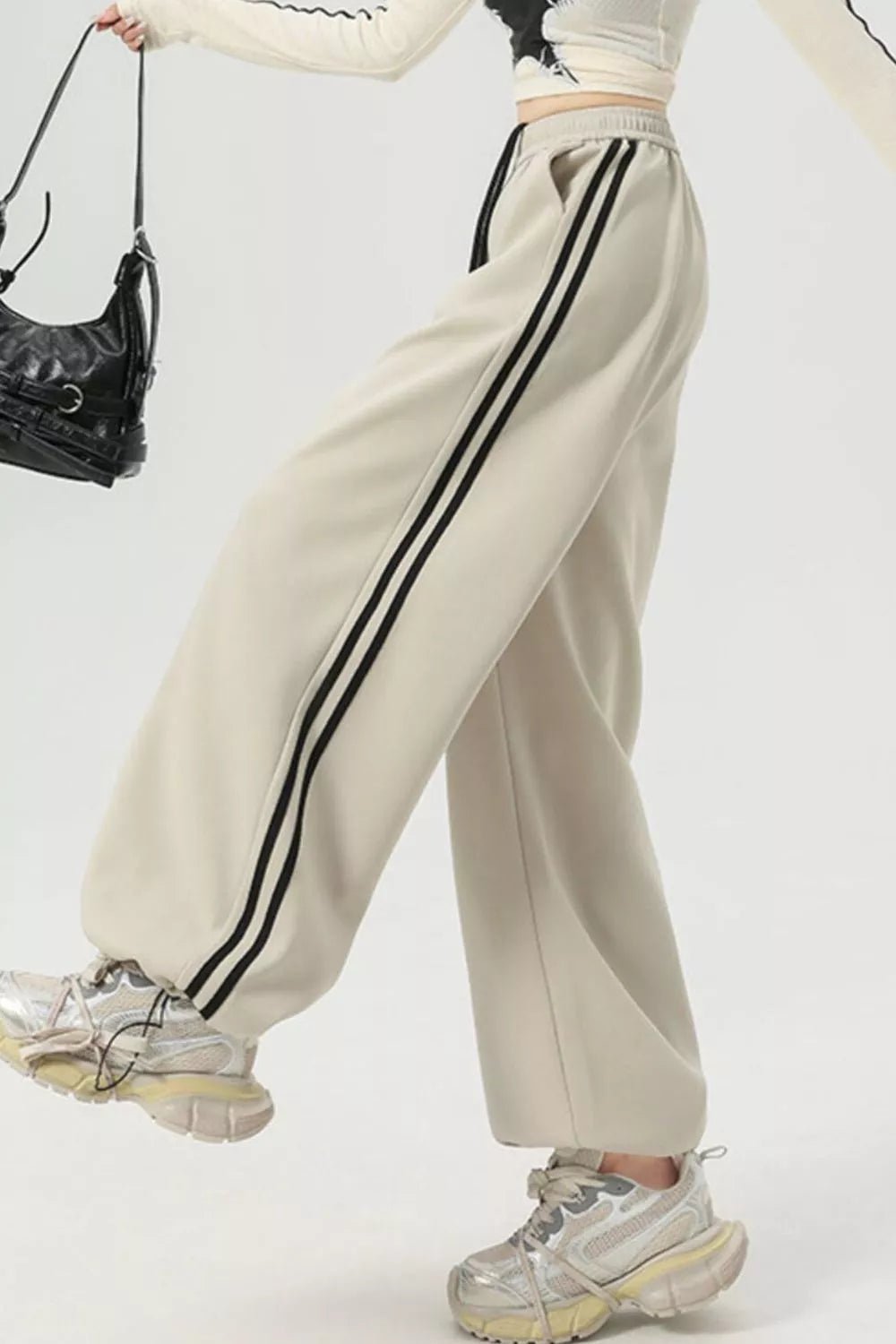 Elegant striped wide leg pants perfect for professional and casual wear, featuring a comfortable and stylish fit.