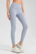 Wide waistband sport leggings providing comfort and support, ideal for active wear and fitness workouts.