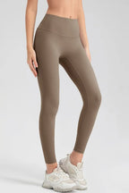 Wide waistband sport leggings providing comfort and support, ideal for active wear and fitness workouts.